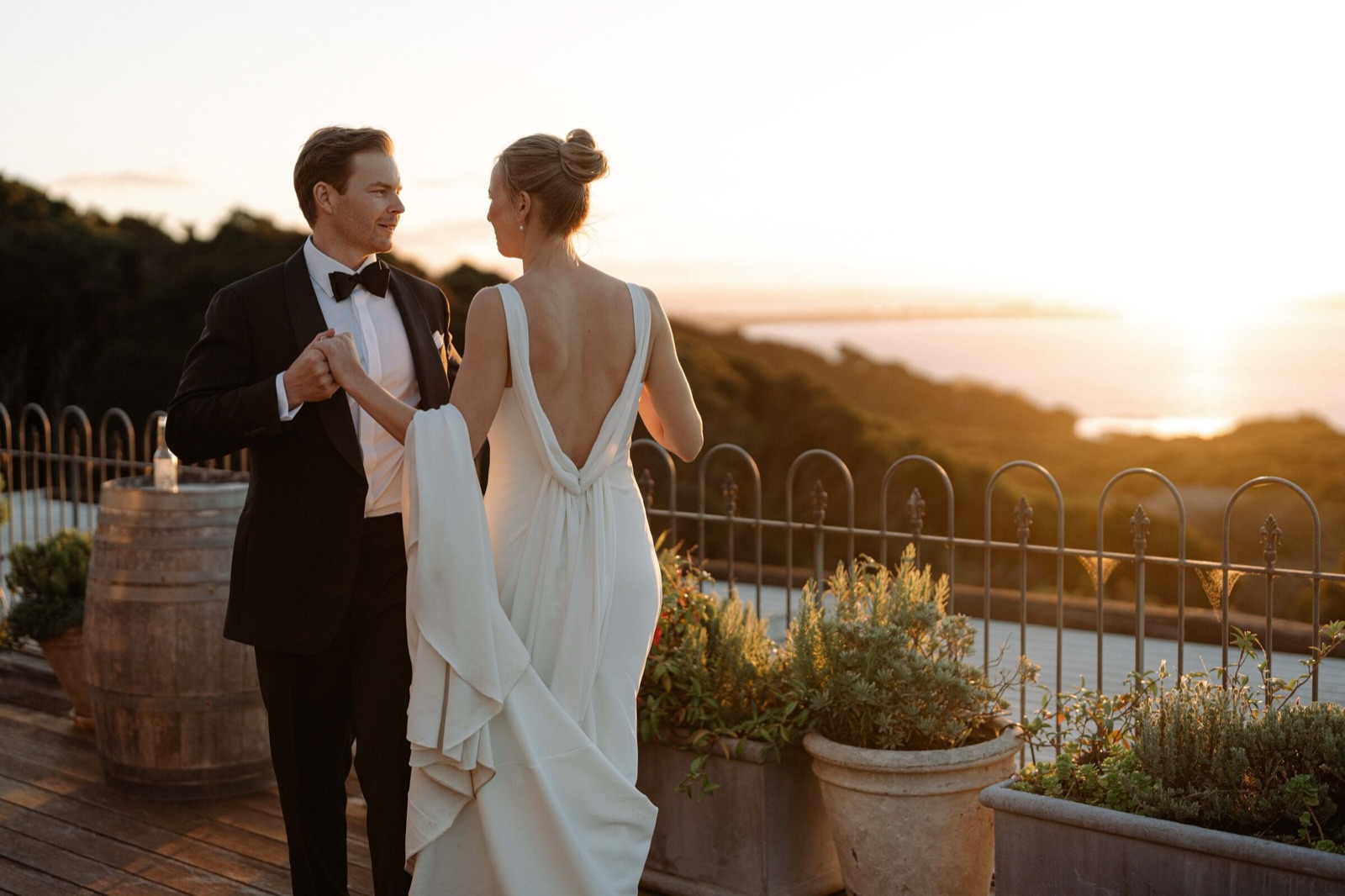 Couple watching the sunset over the sea